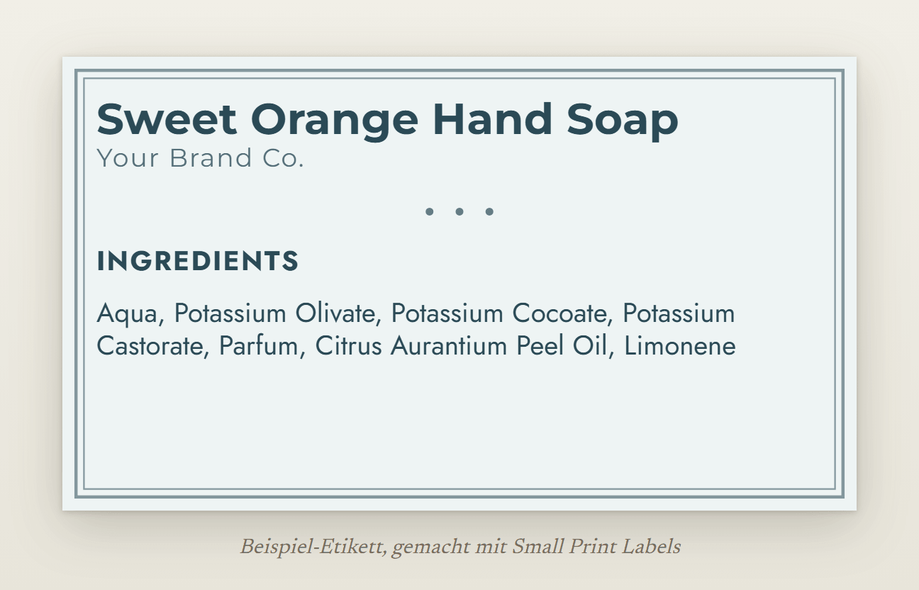 Beispiel-Etikett für eine Flüssigseife in Hellblau mit doppeltem Rahmen: Sweet Orange Hand Soap und die Liste der Bestandteile mit den Namen der Kaliumseifen und dem Orangenöl, 70 × 40 mm