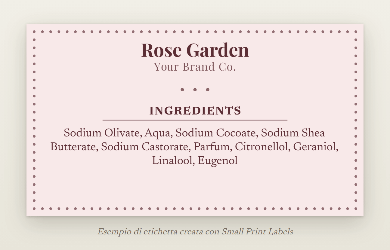 Esempio di etichetta di sapone per il Regno Unito, rosa cipria con una cornice di perline: sapone Rose Garden e il suo elenco degli ingredienti con «Parfum» e quattro allergeni delle fragranze, 70 × 40 mm