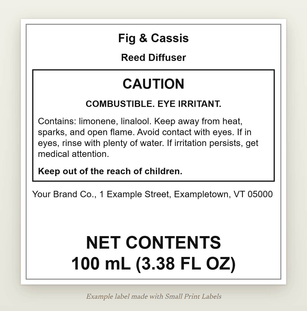 Example US reed diffuser label: Fig & Cassis Reed Diffuser, a boxed warning with CAUTION, COMBUSTIBLE and EYE IRRITANT, the components named, precautions, first aid, the maker's name and address, and NET CONTENTS 100 mL (3.38 FL OZ) at the bottom, 70 × 70 mm