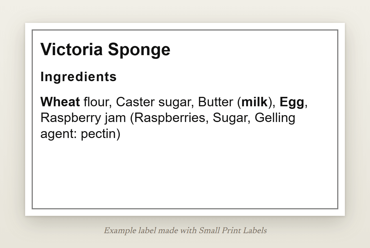 Example Natasha's Law label for a Victoria sponge: the name of the food and the ingredient list with wheat, milk and egg in bold, 63 × 38 mm