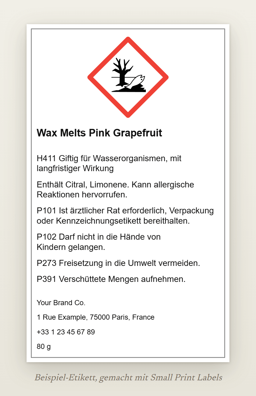 Beispiel-Etikett von Wax Melts mit dem Umwelt-Piktogramm GHS09: Wax Melts Pink Grapefruit, H411, die EUH208-Zeile mit Citral und Limonene, vier Sicherheitshinweise und die Angaben zum Lieferanten, 60 × 100 mm