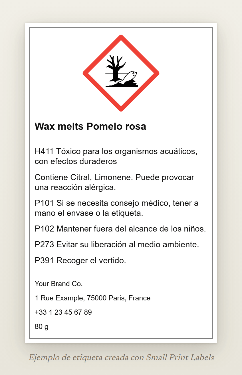 Ejemplo de etiqueta de wax melts con el pictograma del medio ambiente GHS09: Wax melts Pomelo rosa, H411, la línea EUH208 que indica Citral y Limonene, cuatro consejos de prudencia y los datos del proveedor, 60 × 100 mm