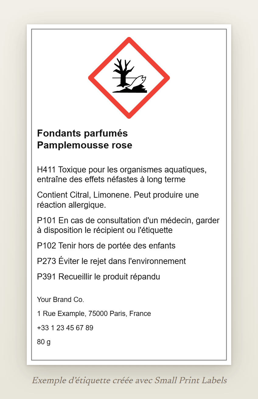 Exemple d'étiquette de fondants parfumés avec le pictogramme environnement SGH09 : Fondants parfumés Pamplemousse rose, H411, la ligne EUH208 nommant Citral et Limonene, quatre conseils de prudence et les coordonnées du fournisseur, 60 × 100 mm