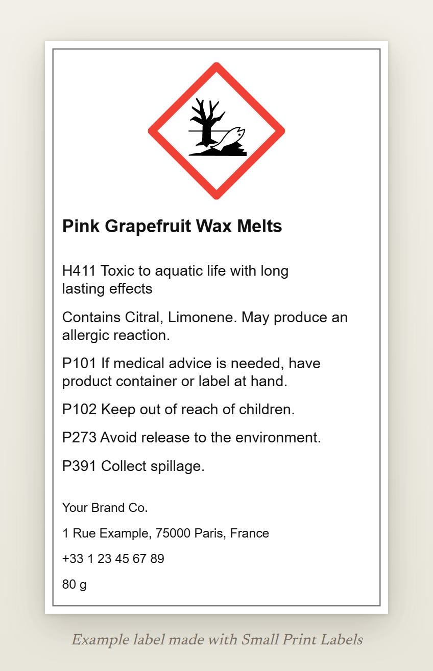 Example wax melt label with the GHS09 environment pictogram: Pink Grapefruit Wax Melts, H411, the EUH208 line naming citral and limonene, four precautionary statements and the supplier details, 60 × 100 mm