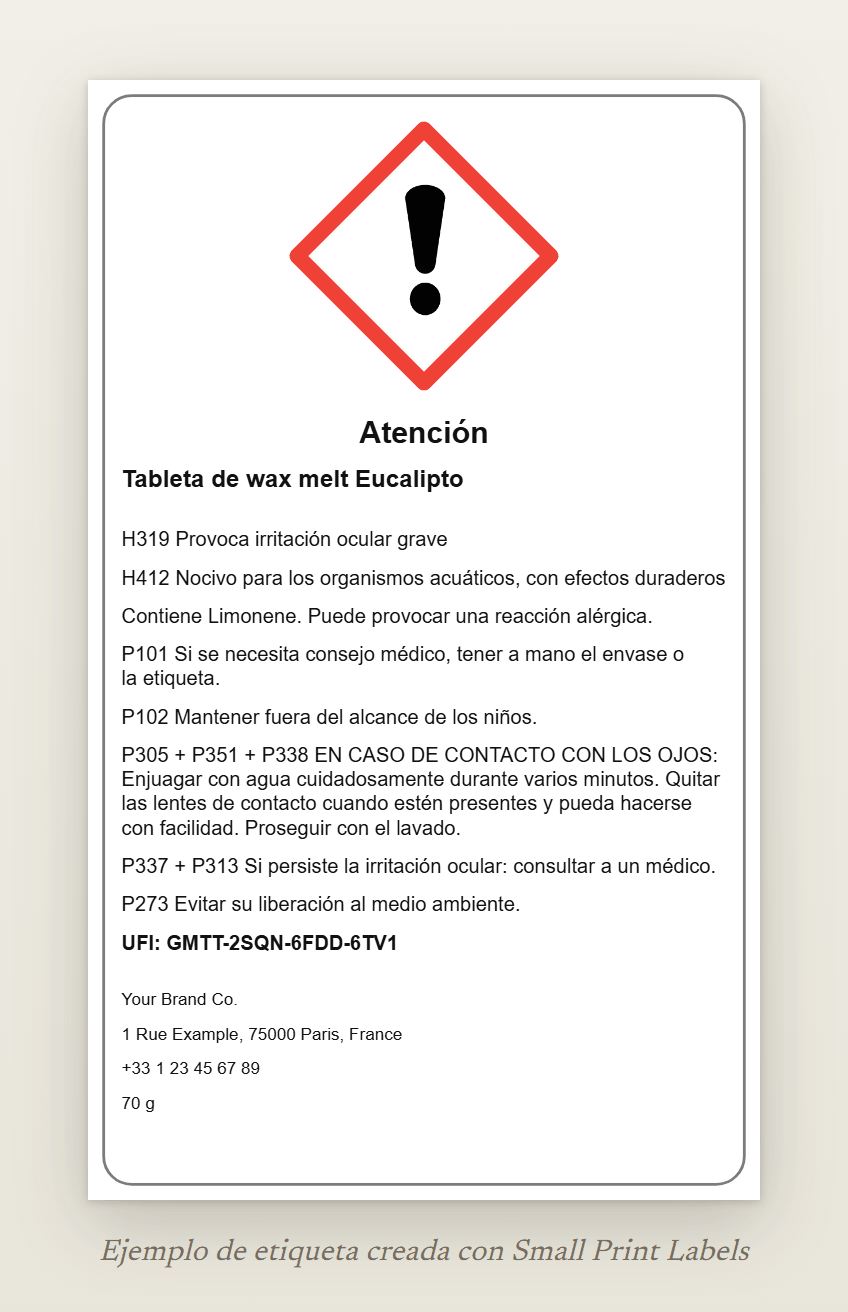 Ejemplo de etiqueta de una tableta de wax melt con el signo de exclamación GHS07 y la palabra de advertencia Atención: Tableta de wax melt Eucalipto, H319 y H412, la línea EUH208, cinco consejos de prudencia, un UFI y los datos del proveedor, 60 × 100 mm
