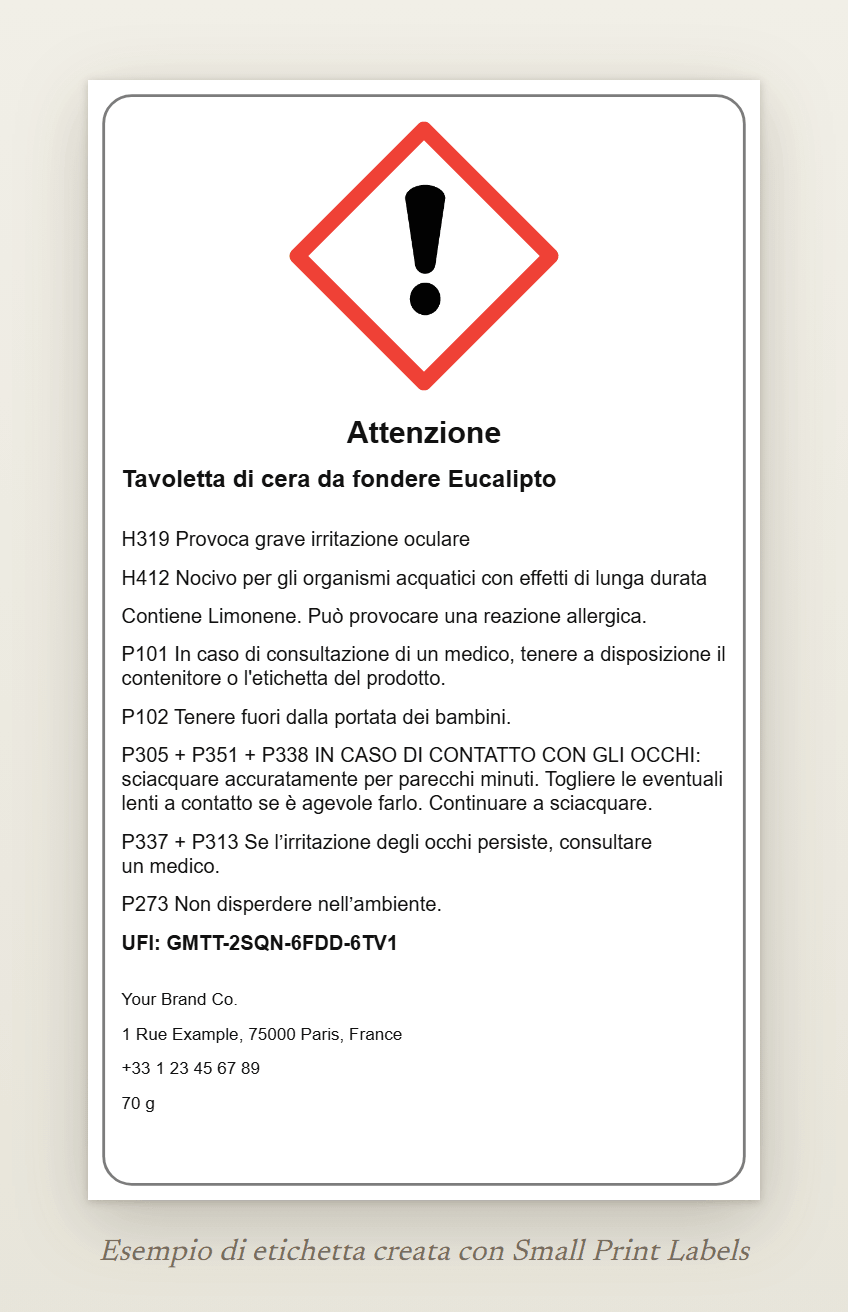 Esempio di etichetta per una tavoletta di cera profumata da fondere con il punto esclamativo GHS07 e l'avvertenza Attenzione: Tavoletta di cera da fondere Eucalipto, H319 e H412, la riga EUH208, cinque consigli di prudenza, un UFI e i dati del fornitore, 60 × 100 mm